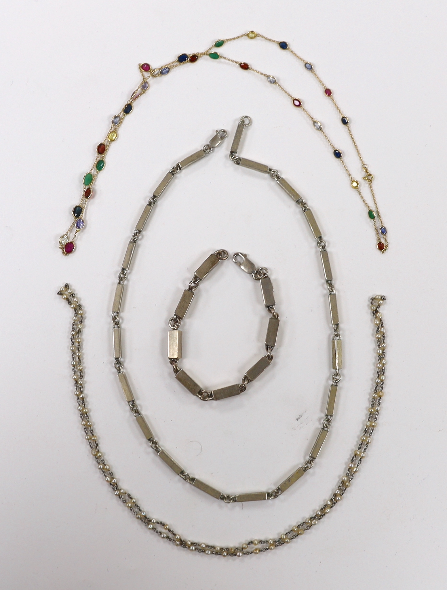 A 585 yellow metal and multi gem set spectacle necklace, 65cm, gross weight 7.9 grams, a 925 box link bracelet and bracelet and a ‘seed pearl’ chain